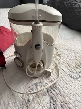Works great with several attachments. Electric Water Flosser in White